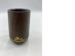 This wooden cup is made from dark hardwood.