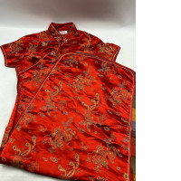 Red cheongsam dress with gold dragon pattern