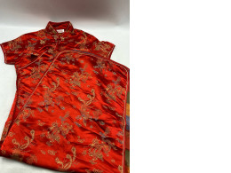 Red cheongsam dress with gold dragon pattern