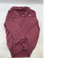 A dark red, long-sleeved sweater in a polo shirt style.