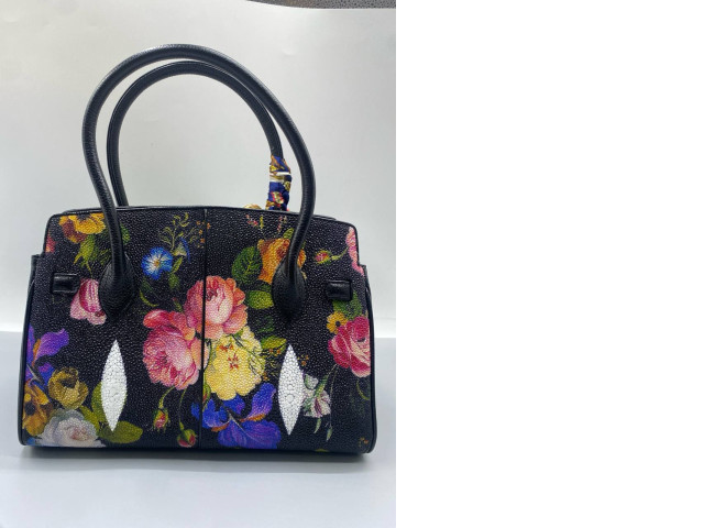 stingray leather top-handle handbag with a hand-painted floral pattern. stingray leather top-handle handbag with a hand-painted floral pattern.