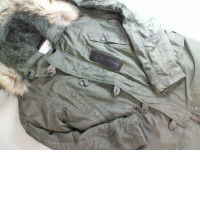 Green jacket with a fur hood