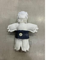 a plush toy depicting a little man