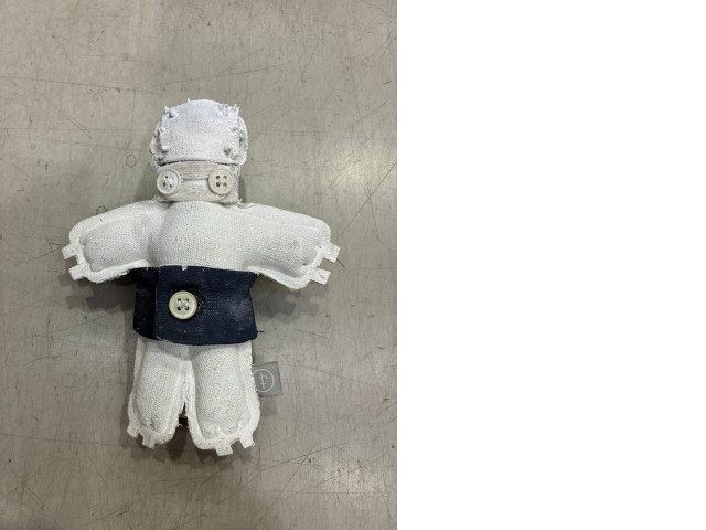 a plush toy depicting a little man a plush toy depicting a little man