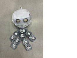 a plush toy depicting a little man