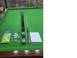 pool or snooker cue set, featuring an O'Min cue, a black aluminum hard case, and accessories. 