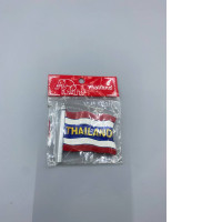 Refrigerator magnet in the shape of the Thai flag.