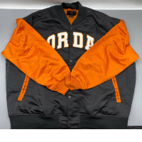 Jordan Brooklyn Collegiate Varsity Jacket in black and orange with a water-repellent shell and satin-stitched details. Jordan Brooklyn Collegiate Varsity Jacket in black and orange with a water-repellent shell and satin-stitched details.