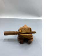  hand-carved wooden frog guiro rasp, a musical percussion instrument. 