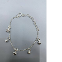 Silver bracelet with a star charm.