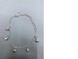 Silver bracelet with a star charm. Silver bracelet with a star charm.