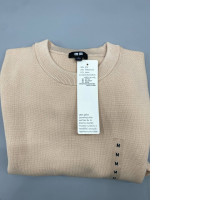 Uniqlo crew neck sweater in a light beige color, made from a blend of cotton, polyester, and viscose/rayon. Uniqlo crew neck sweater in a light beige color, made from a blend of cotton, polyester, and viscose/rayon.