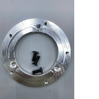 An aluminum mounting plate or adapter, likely for automotive use, could be an adapter ring for a horn button on a steering wheel or a base plate for an ignition switch.