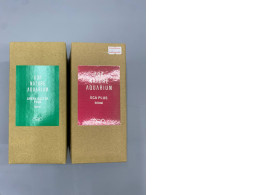 Set of 2 The box with the green label contains ADA Nature Aquarium Green Bacter Plus, a bacterial additive. The box with the red label contains ADA Nature Aquarium ECA Plus, a plant supplement containing iron and organic acids to enhance plant coloration.