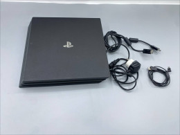 Sony PlayStation 4 Pro 1TB game console with charging cable. (NOT NEW)