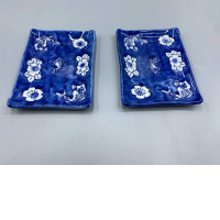 Set of 2 Japanese Seto ware small rectangular plates, possibly mamezara, featuring a blue and white design of fish and flowers. 