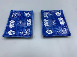 Set of 2 Japanese Seto ware small rectangular plates, possibly mamezara, featuring a blue and white design of fish and flowers. Set of 2 Japanese Seto ware small rectangular plates, possibly mamezara, featuring a blue and white design of fish and flowers.