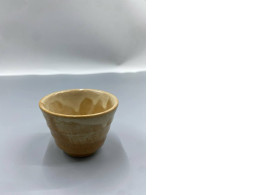 This Japanese hagi glass cup is likely a sake cup (guinomi).