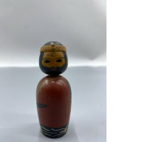 vintage Japanese kokeshi wooden bobblehead doll, which is a traditional folk craft originating from the Tōhoku region of Japan. 