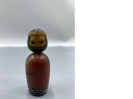 vintage Japanese kokeshi wooden bobblehead doll, which is a traditional folk craft originating from the Tōhoku region of Japan. 