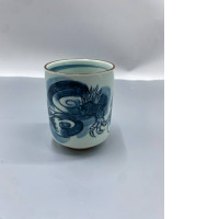 Japanese teacups made from hasami-yaki porcelain, also known as yunomi, feature a cobalt blue dragon (ryu) motif underglaze.