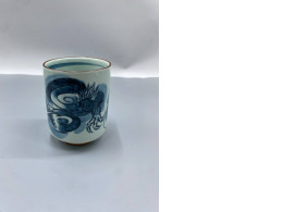 Japanese teacups made from hasami-yaki porcelain, also known as yunomi, feature a cobalt blue dragon (ryu) motif underglaze.