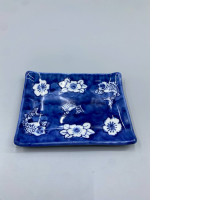  small blue and white Japanese porcelain floral trinket dish featuring fish motifs. 