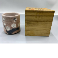 Japanese tea cup with cherry blossom design, in a wooden box.