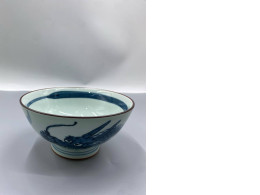 Saikai Pottery Hasami ware porcelain rice bowl with a blue dragon pattern. Saikai Pottery Hasami ware porcelain rice bowl with a blue dragon pattern.