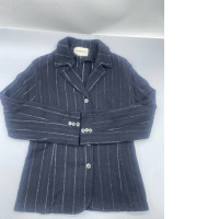 Lautreamont brand blazer is a navy blue structured jacket featuring white vertical stripes, long sleeves, and a button-down front. Lautreamont brand blazer is a navy blue structured jacket featuring white vertical stripes, long sleeves, and a button-down front.