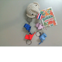 A set of Thai souvenirs: 5 keychains and 1 magnet.
