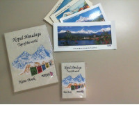 A set of 2 notebooks and 4 postcards from Nepal.