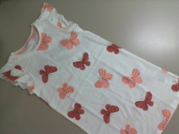 Children's beige dress with a butterfly