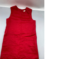 A short red linen dress from the brand Reformation.