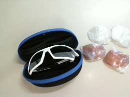 Sunglasses in a case with replaceable lenses