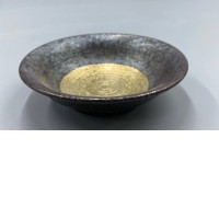 The cup has a golden circular pattern.