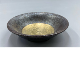 The cup has a golden circular pattern.