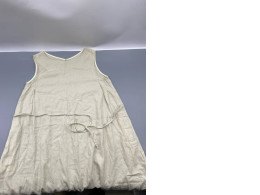 Loose-fitting A-line linen dress in beige.