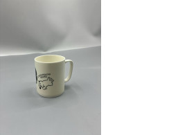 Glass, coffee mug with a white handle.