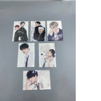 Set of 6 K-pop collectible photocards featuring members of the group. 