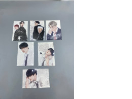 Set of 6 K-pop collectible photocards featuring members of the group. Set of 6 K-pop collectible photocards featuring members of the group.