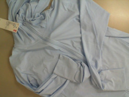 Light blue women's sports jacket with a hood