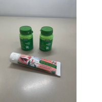 A set of three items: toothpaste and two polishing powders.