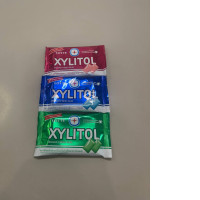 A set of three packs of chewing gum