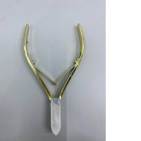 Gold-colored cuticle nippers with sharp blades.