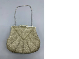 This shoulder bag is a vintage-style beaded handbag.