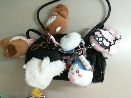 Black ladies' bag decorated with soft keychains