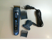 Rowenta electric razor with three replaceable attachments and a charging cable