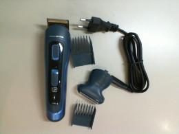 Rowenta electric razor with three replaceable attachments and a charging cable
