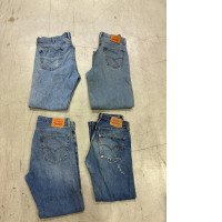 Set of 4 vintage Levi's denim jeans, specifically featuring the 505 straight-leg model. 